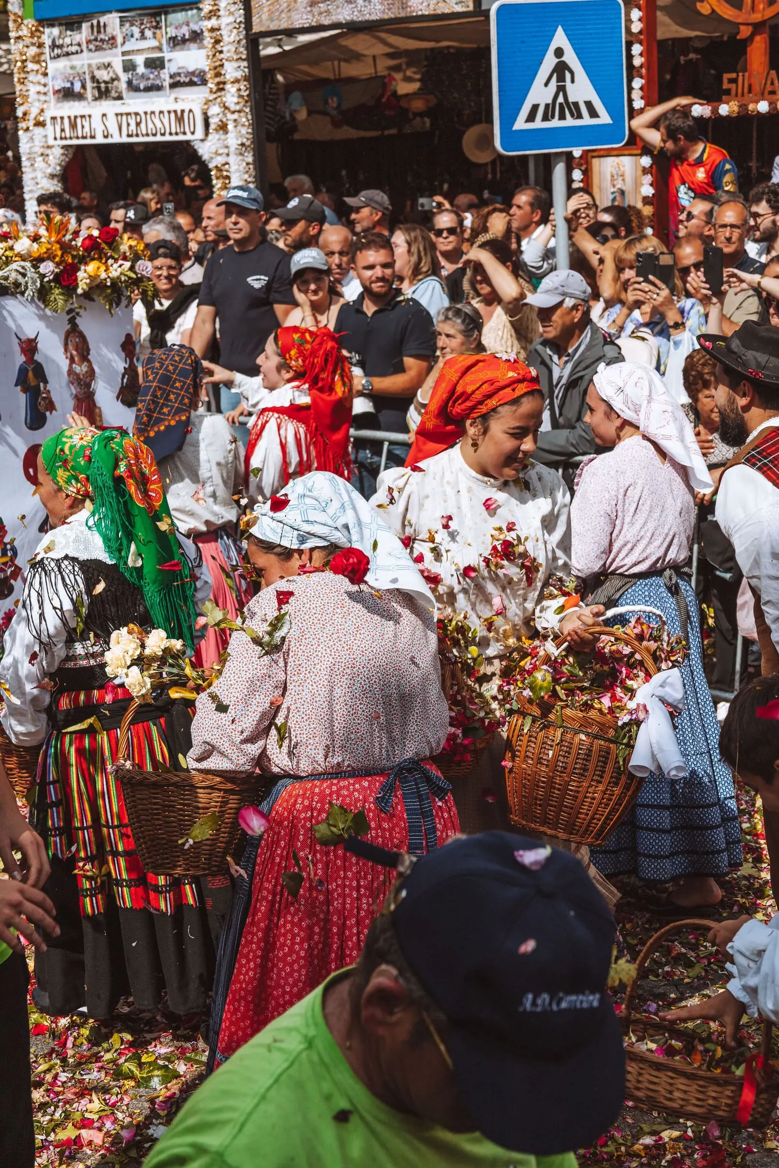 Women in traditional Portuguese festival dress at a romaria in Barcelos